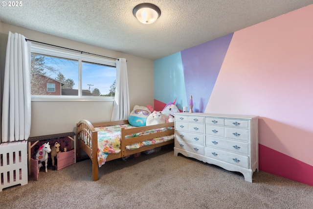 carpeted bedroom featuring a textured ceiling