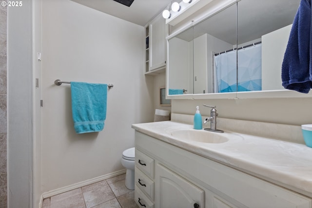 bathroom with vanity, a shower with shower curtain, and toilet