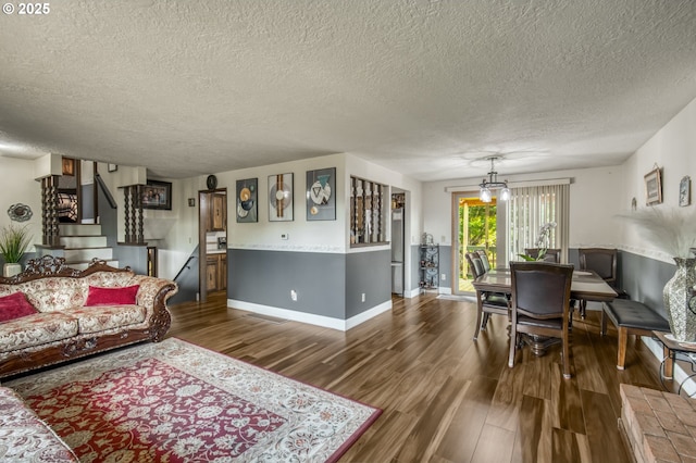 642 SW Cherry Park Rd, Troutdale, OR 97060 - living room featuring a textured ceiling, wood finished floors, and stairs