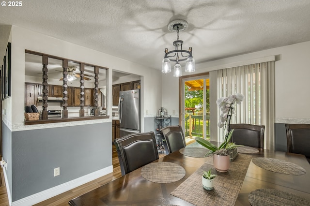 642 SW Cherry Park Rd, Troutdale, OR 97060 - dining space with wood finished floors, ceiling fan, and a textured ceiling