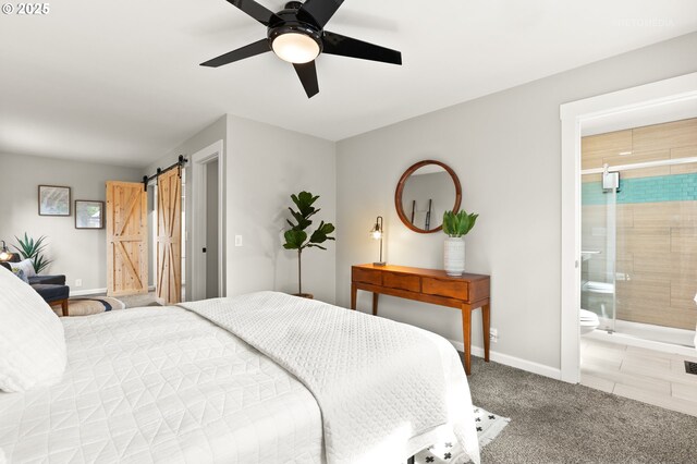 2338 NE 137th Ave, Portland, OR 97230 - carpeted bedroom featuring a barn door, a ceiling fan, and ensuite bath