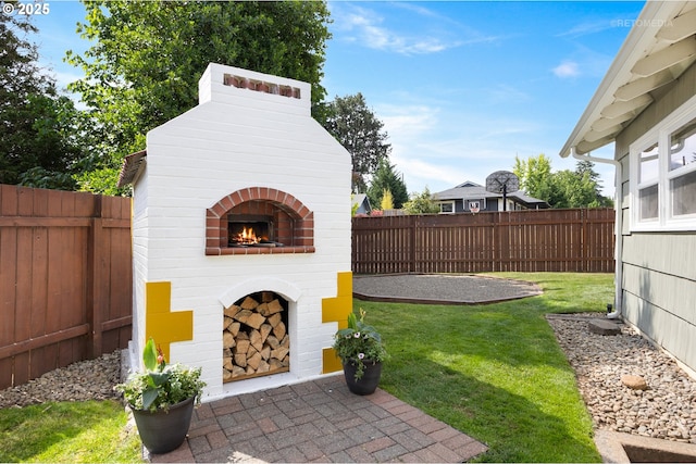 2338 NE 137th Ave, Portland, OR 97230 - fenced backyard featuring an outdoor brick fireplace