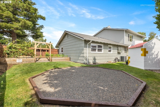 2338 NE 137th Ave, Portland, OR 97230 - rear view of house featuring a garden, a storage unit, and a chimney