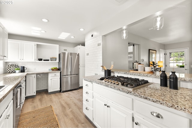 2338 NE 137th Ave, Portland, OR 97230 - kitchen with appliances with stainless steel finishes, white cabinets, open shelves, tasteful backsplash, and recessed lighting