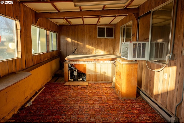 unfurnished sunroom featuring a baseboard heating unit