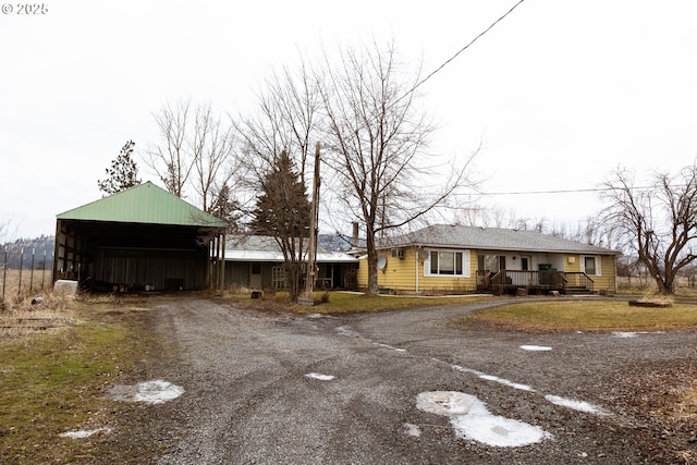 view of street featuring driveway and an outbuilding