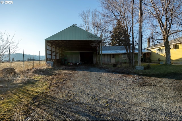 view of pole building featuring driveway