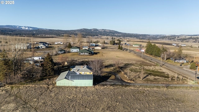 bird's eye view with a rural view and a mountain view