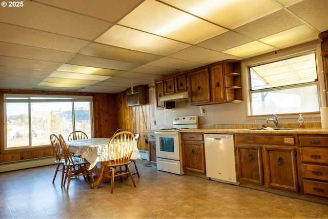 kitchen with light floors, white appliances, a sink, and under cabinet range hood