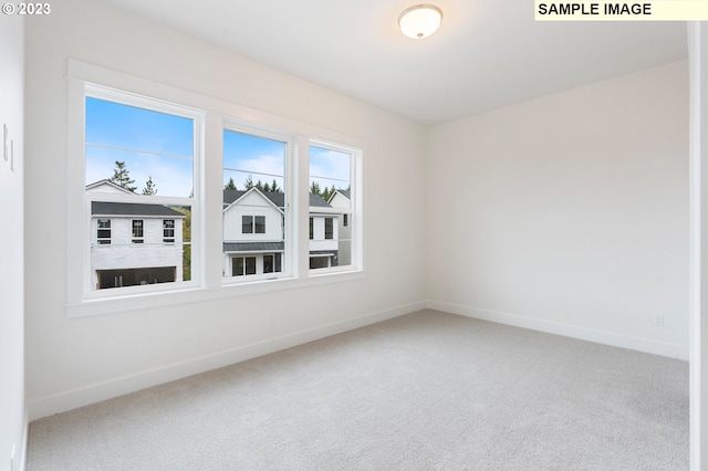 empty room featuring carpet flooring