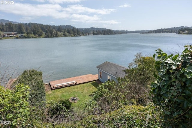 4304 NE 42nd St, Neotsu, OR 97364 - property view of water featuring a dock and a view of trees