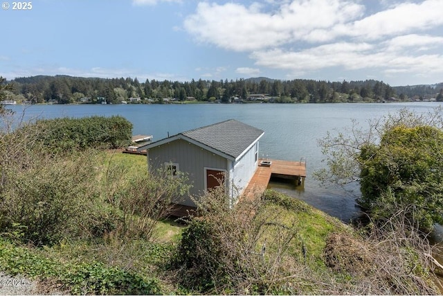 4304 NE 42nd St, Neotsu, OR 97364 - dock area featuring a wooded view and a water view