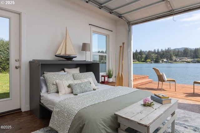 4304 NE 42nd St, Neotsu, OR 97364 - bedroom featuring wood finished floors, a water view, and multiple windows