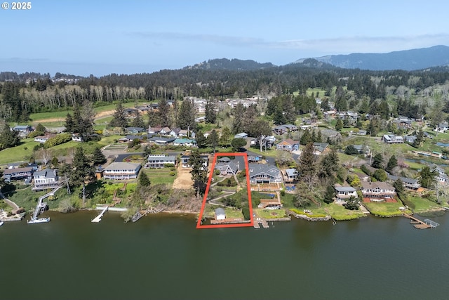 4304 NE 42nd St, Neotsu, OR 97364 - drone / aerial view with a water and mountain view, a residential view, and a forest view