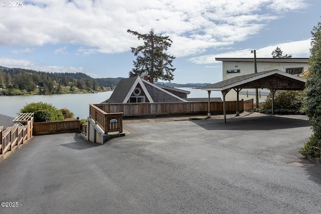 4304 NE 42nd St, Neotsu, OR 97364 - view of vehicle parking with fence and a water view