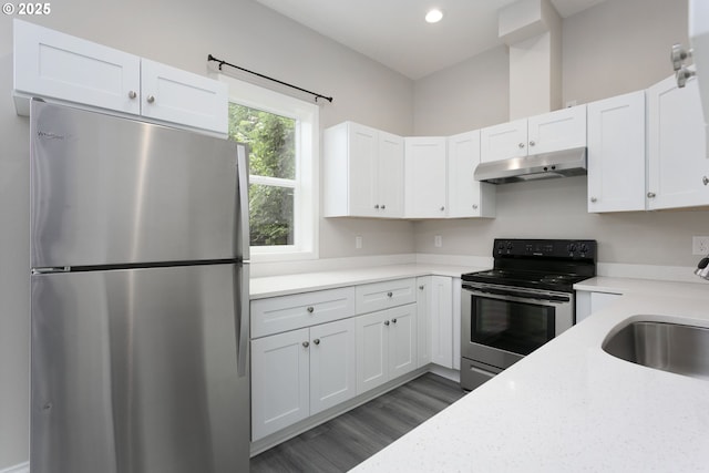 9638 SE Holgate Blvd Unit 1, 2, 3, Portland, OR 97266 - kitchen featuring a sink, under cabinet range hood, white cabinetry, appliances with stainless steel finishes, and dark wood finished floors
