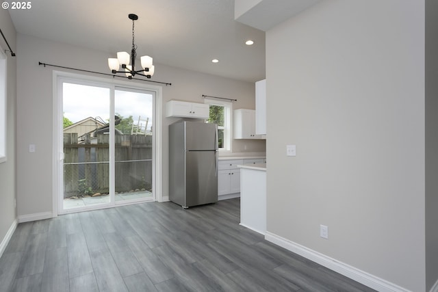 9638 SE Holgate Blvd Unit 1, 2, 3, Portland, OR 97266 - unfurnished dining area featuring recessed lighting, wood finished floors, a chandelier, and baseboards