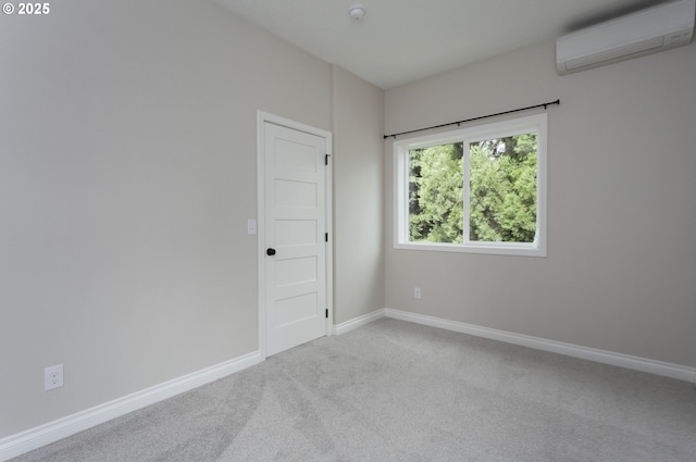 9638 SE Holgate Blvd Unit 1, 2, 3, Portland, OR 97266 - empty room featuring an AC wall unit, carpet floors, and baseboards
