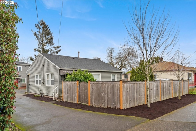 9638 SE Holgate Blvd Unit 1, 2, 3, Portland, OR 97266 - view of home's exterior featuring fence and a shingled roof