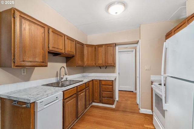 9638 SE Holgate Blvd Unit 1, 2, 3, Portland, OR 97266 - kitchen with brown cabinets, white appliances, light wood finished floors, and a sink