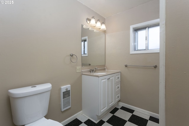 9638 SE Holgate Blvd Unit 1, 2, 3, Portland, OR 97266 - half bathroom featuring heating unit, tile patterned floors, toilet, vanity, and baseboards