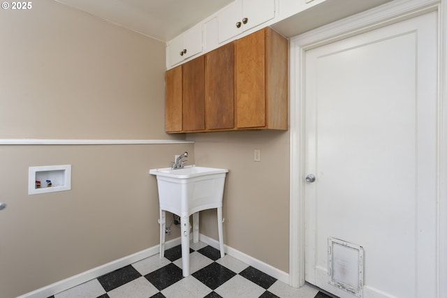 9638 SE Holgate Blvd Unit 1, 2, 3, Portland, OR 97266 - laundry room featuring light floors, washer hookup, cabinet space, and baseboards
