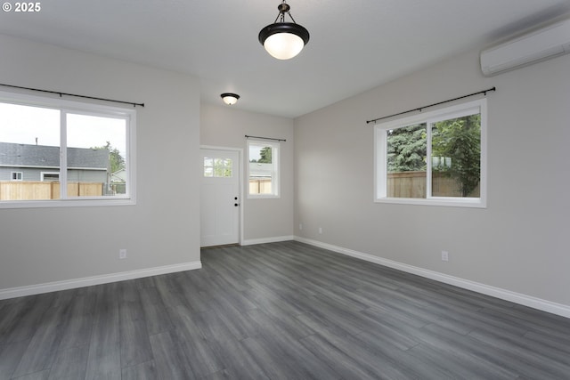 9638 SE Holgate Blvd Unit 1, 2, 3, Portland, OR 97266 - empty room with baseboards, a wall mounted air conditioner, and dark wood-type flooring