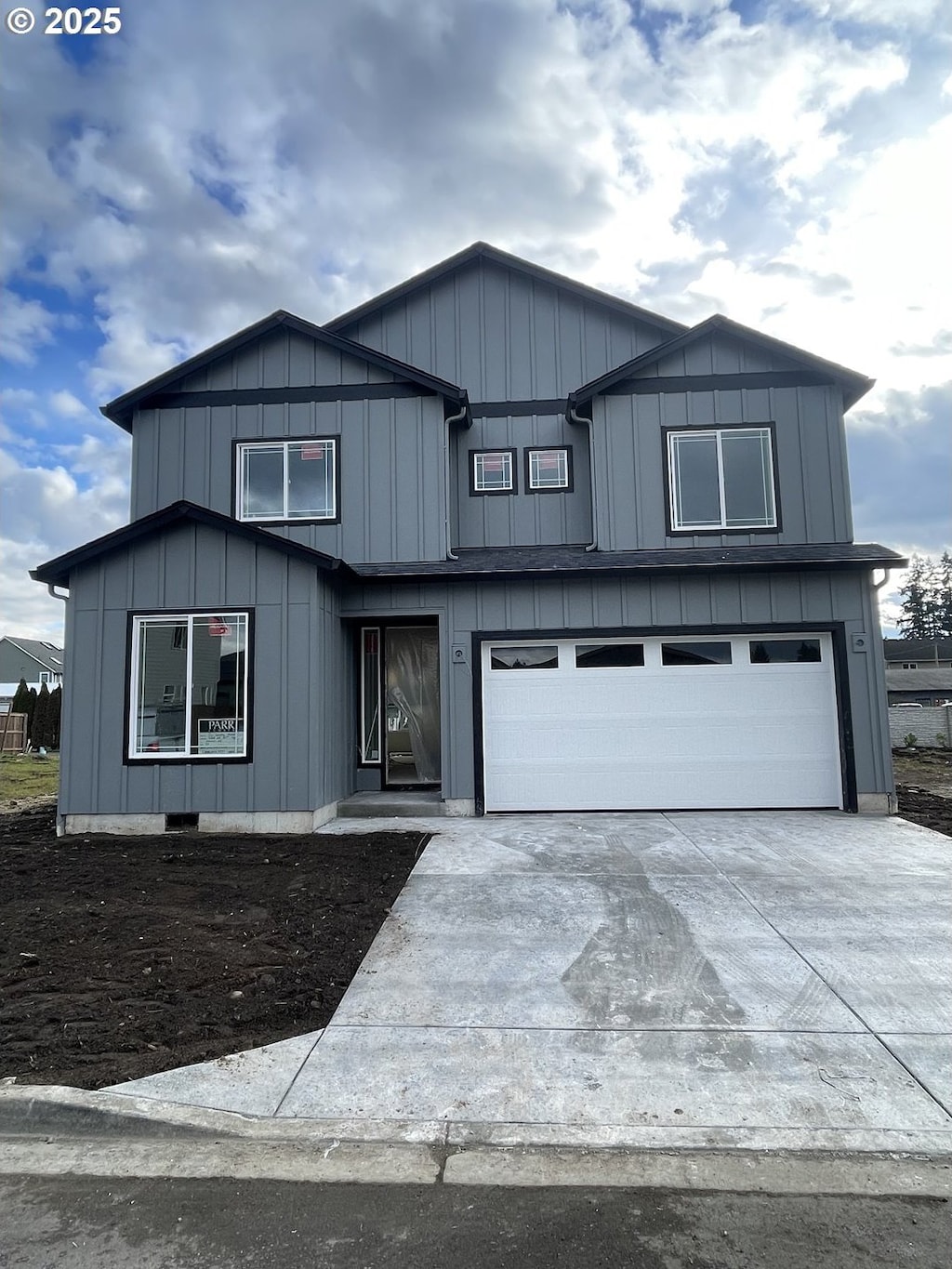 view of front of property with a garage