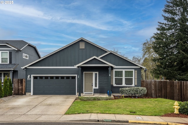 view of front of property with a front lawn, fence, a garage, and concrete driveway