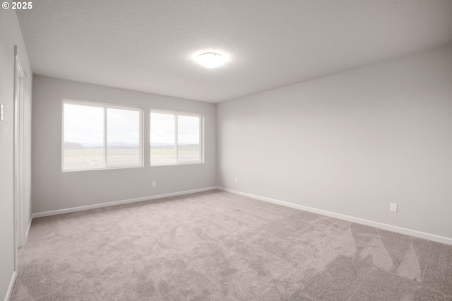 5954 Henshaw St SE, Albany, OR 97322 - carpeted empty room with baseboards