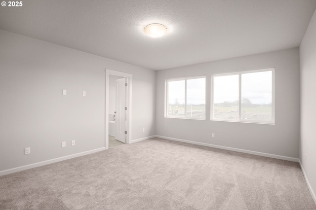 5954 Henshaw St SE, Albany, OR 97322 - spare room with light colored carpet and baseboards