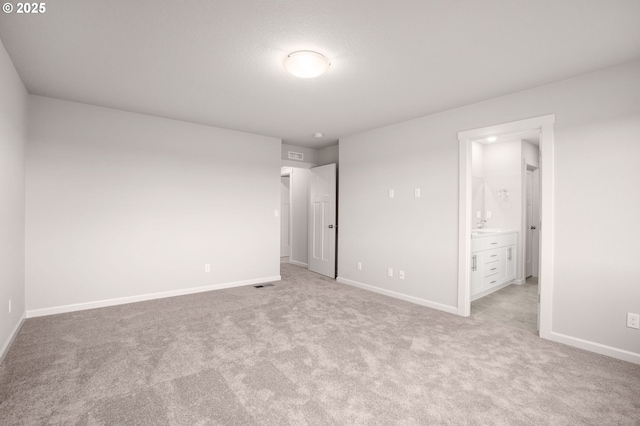 5954 Henshaw St SE, Albany, OR 97322 - unfurnished bedroom featuring light carpet, baseboards, and ensuite bathroom