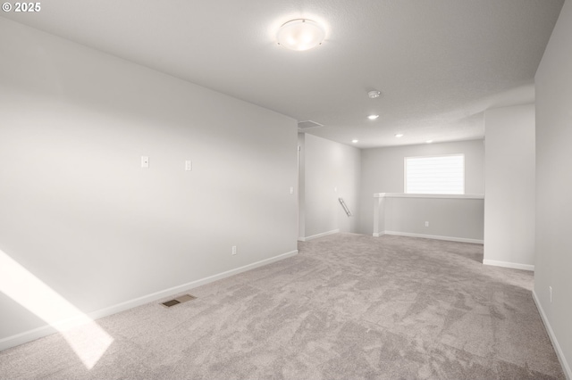 5954 Henshaw St SE, Albany, OR 97322 - empty room with light colored carpet, baseboards, and recessed lighting