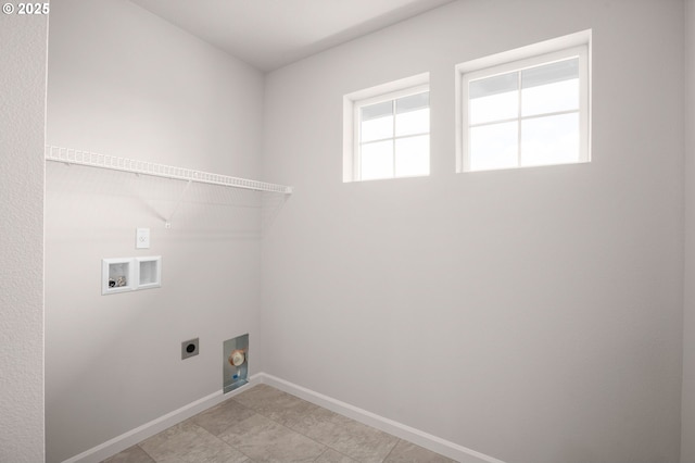 5954 Henshaw St SE, Albany, OR 97322 - washroom featuring hookup for an electric dryer, washer hookup, baseboards, and light tile patterned floors