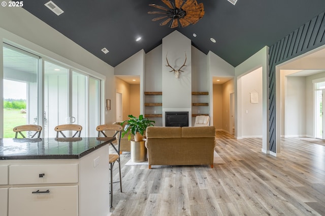 641 E Jones St, Yacolt, WA 98675 - living area with a glass covered fireplace, light wood finished floors, and high vaulted ceiling