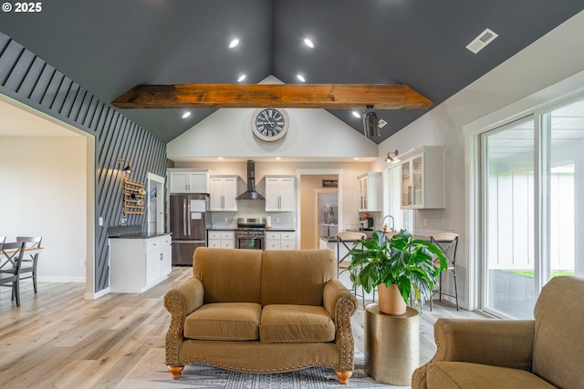 641 E Jones St, Yacolt, WA 98675 - living area featuring healthy amount of natural light, light wood-style floors, beamed ceiling, high vaulted ceiling, and baseboards
