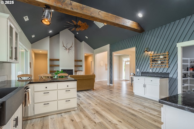 641 E Jones St, Yacolt, WA 98675 - kitchen with light wood-style flooring, beamed ceiling, high vaulted ceiling, white cabinetry, and open floor plan