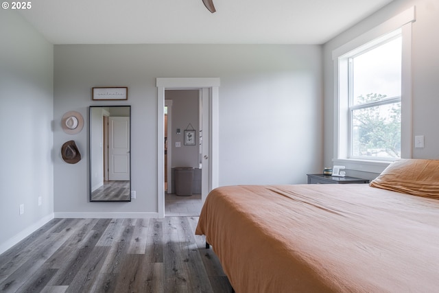 641 E Jones St, Yacolt, WA 98675 - bedroom with wood finished floors, baseboards, and ensuite bathroom