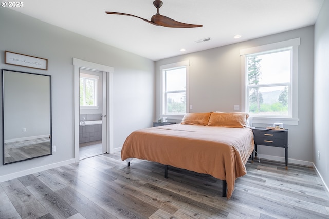 641 E Jones St, Yacolt, WA 98675 - bedroom with light wood finished floors, baseboards, recessed lighting, ensuite bath, and ceiling fan