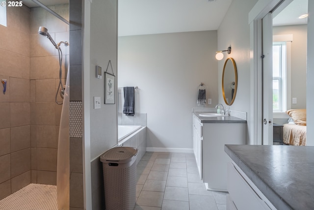 641 E Jones St, Yacolt, WA 98675 - full bathroom featuring vanity, a tile shower, tile patterned flooring, a bath, and baseboards