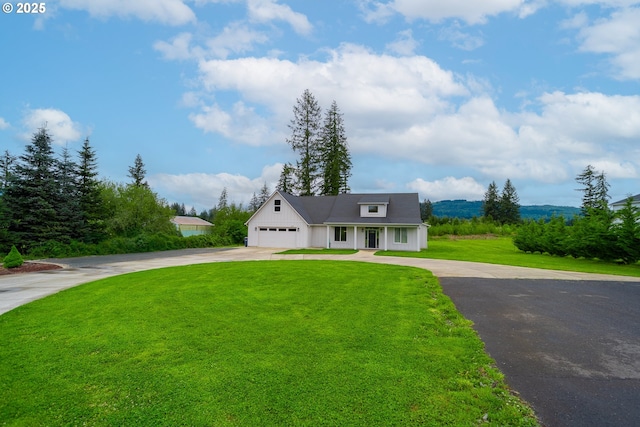 641 E Jones St, Yacolt, WA 98675 - modern farmhouse featuring driveway, a front lawn, board and batten siding, and covered porch