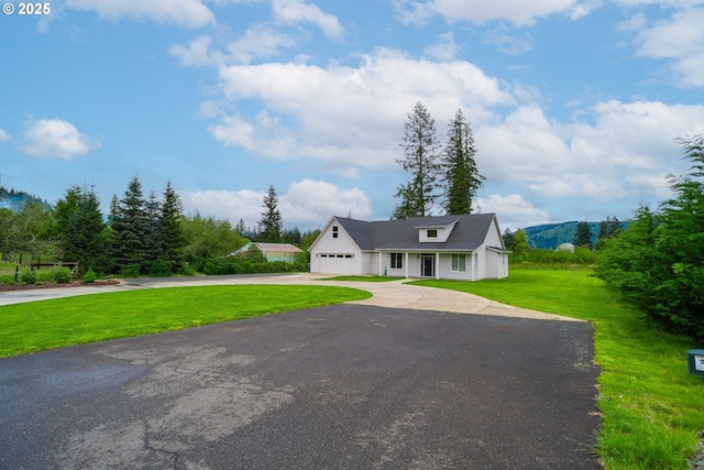 641 E Jones St, Yacolt, WA 98675 - modern farmhouse with asphalt driveway, a front lawn, and an attached garage