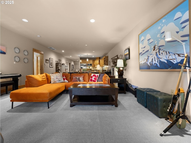 living room featuring light colored carpet and recessed lighting