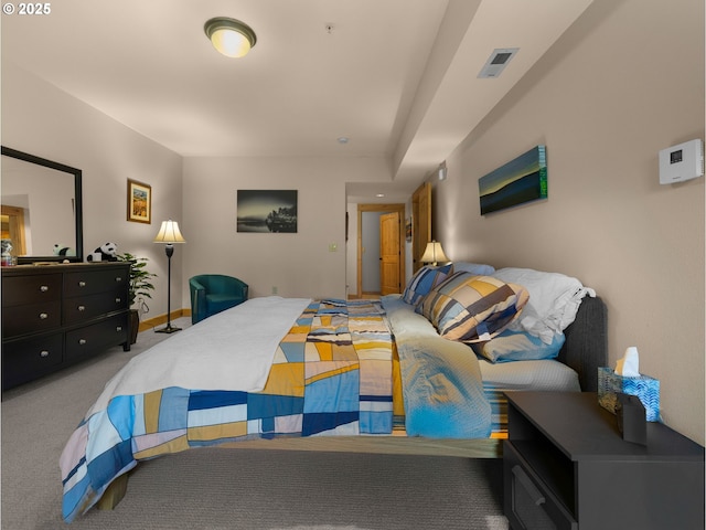 carpeted bedroom featuring baseboards