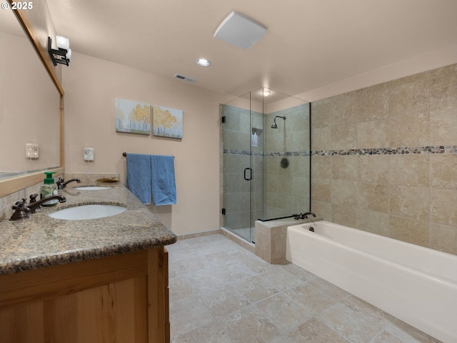 bathroom with a bath, a stall shower, vanity, baseboards, and recessed lighting