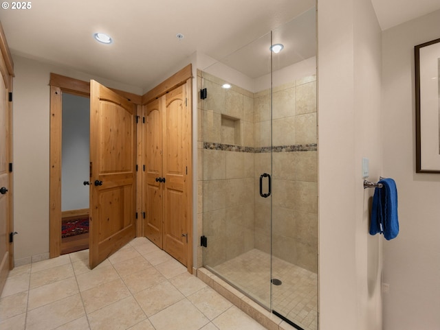 full bathroom featuring a stall shower, tile patterned floors, recessed lighting, and baseboards