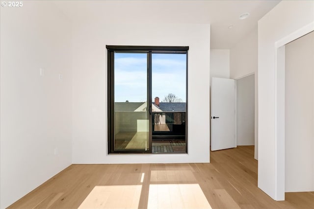 spare room featuring light wood finished floors