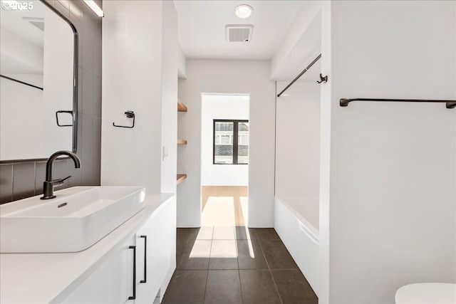 full bath with vanity, visible vents, and tile patterned floors