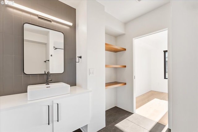 bathroom with tile patterned flooring and vanity