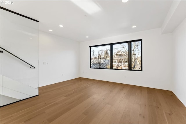 empty room featuring recessed lighting and light wood finished floors